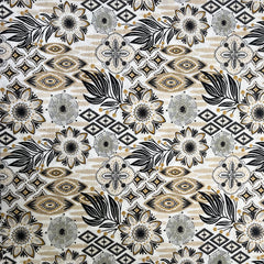 Patterned fabric with black, white, and gold design on a beige background