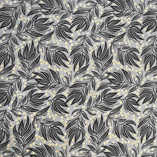 Pattern of black leaves and small yellow flowers on a gray background