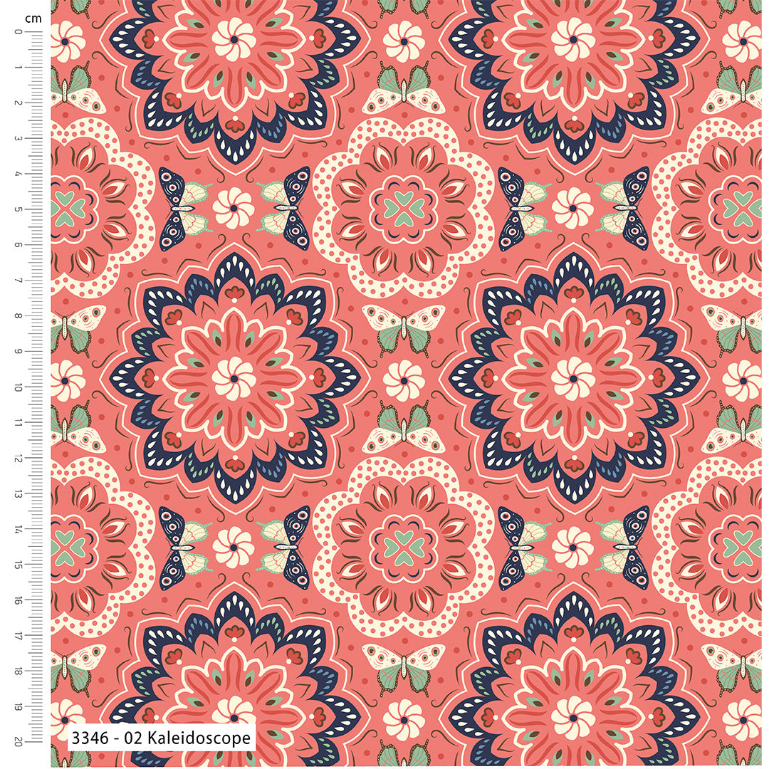 Patterned fabric with kaleidoscope design on a pink background, featuring a ruler for scale.