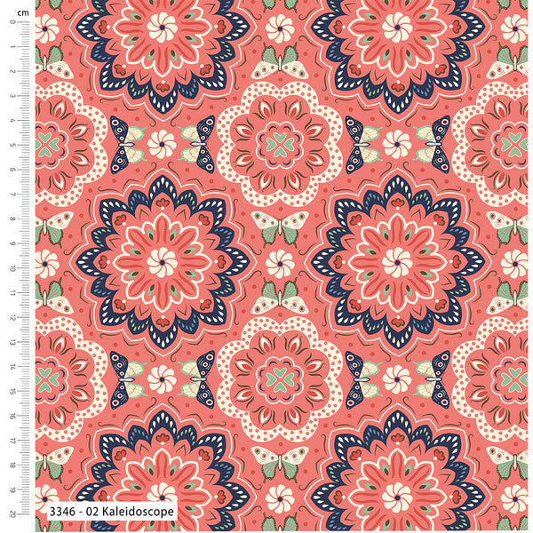 Patterned fabric with kaleidoscope design on a pink background, featuring a ruler for scale.