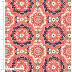 Patterned fabric with kaleidoscope design on a pink background, featuring a ruler for scale.