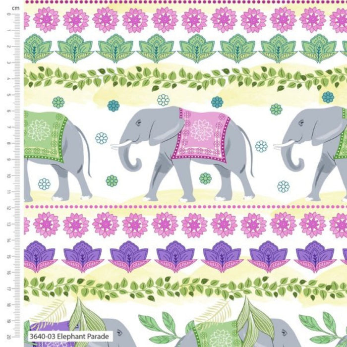 Fabric with elephants and floral patterns, featuring a ruler for scale.