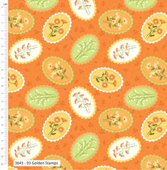 Patterned fabric with floral designs on an orange background, featuring a ruler for scale.