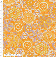 Patterned fabric with floral designs on an orange background, featuring a ruler for scale.