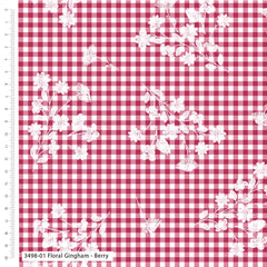 Red and white gingham fabric with white floral pattern, measured against a ruler.