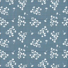 White floral pattern on a blue and white checkered background