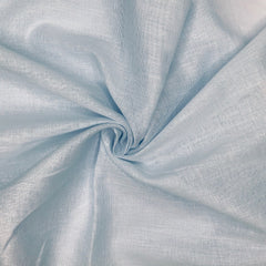 Close-up of light blue fabric with folds

