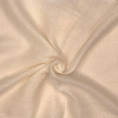 Close-up of beige fabric with a swirl pattern

