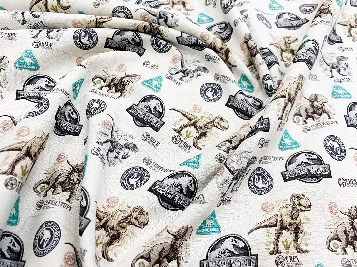 Jurassic World Dinosaur Badge Cotton Fabric